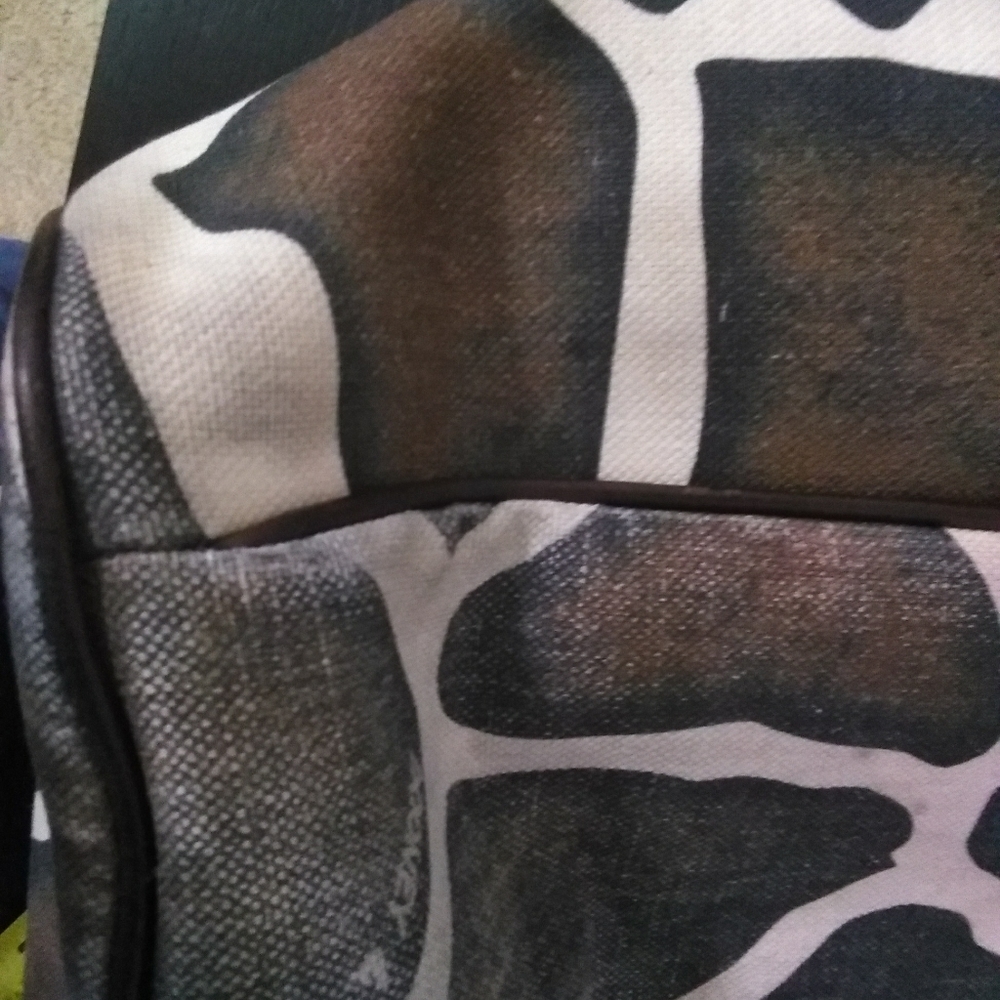 Used Dooney & Bourne Giraffe print handbag. - Picture 9 of 12